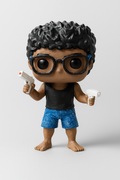 Custom chibi figurine of a person with curly hair and glasses, 3D printed from photos