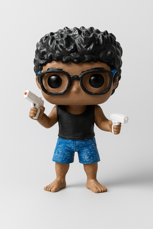 Custom chibi figurine of a person with curly hair and glasses, 3D printed from photos