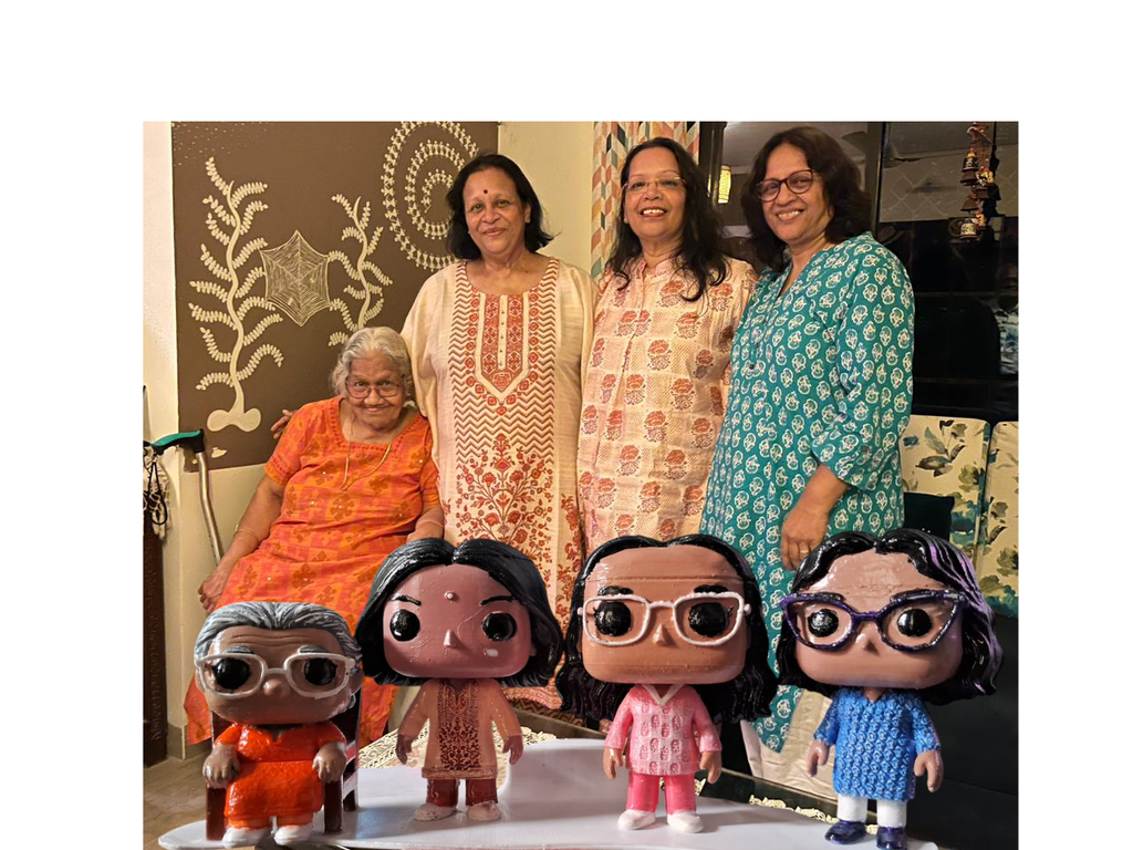 Family standing behind their matching custom figurines, each modelled on a real person